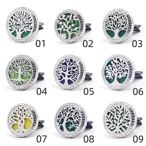 Detail view of nine 30mm stainless steel Tree of Life car aromatherapy vent clips with rhinestones