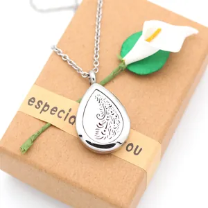 Macro view of a 28mm stainless steel teardrop essential oil aromatherapy necklace