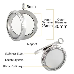 Close-up detail of a 30mm stainless steel magnetic glass locket with rhinestone border