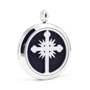 Macro view of stainless steel cross openwork aromatherapy locket pendant with black felt