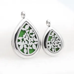 Close-up of teardrop stainless steel aromatherapy pendants with a tree of life cutout