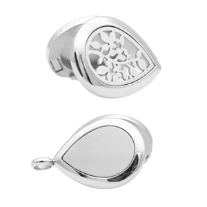 Detailed view of silver stainless steel teardrop aromatherapy locket with floral cutout