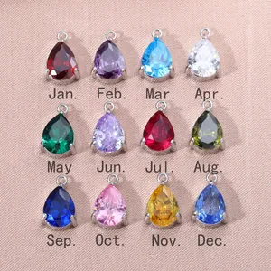 Doce colores de colgantes de piedra de nacimiento de circón en gota para joyería artesanal DIY.