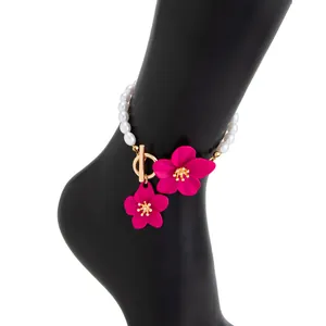 Close-up detail of hot pink oil-drop flower anklet with white pearls and OT buckle