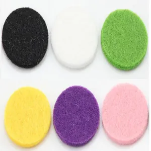 Detail view of colorful round replacement felt pads for car aromatherapy diffuser clips
