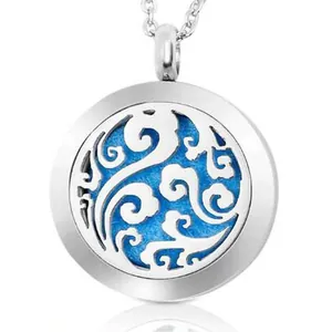 Detailed macro view of a 25mm stainless steel aromatherapy pendant with blue felt pad