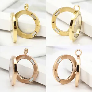 Detailed view of stainless steel magnetic glass locket pendants in gold and rose gold finishes.