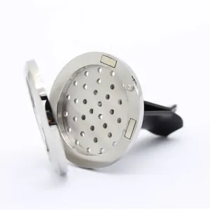 Detail view of magnetic stainless steel car aromatherapy vent clip diffuser locket