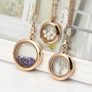 Detail view of round rose gold glass floating locket pendants with pearls and charms