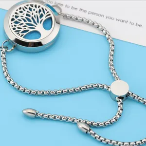 Detailed macro view of 25mm stainless steel tree of life aromatherapy locket bracelet