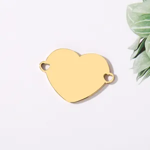 Polished gold stainless steel heart pendant with double side loops for jewelry making