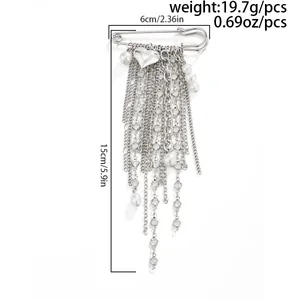 Detailed dimensions of a silver heart tassel brooch with pearls and long metal chains.
