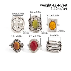 Detailed size measurements for vintage silver-tone ring set featuring colorful stones