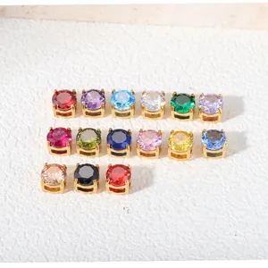 Macro view of various multi-colored 6mm round cubic zirconia beads with gold-tone settings