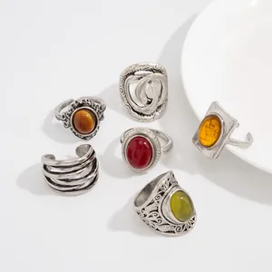 Detailed view of vintage bohemian rings with colorful gemstones and engraved patterns