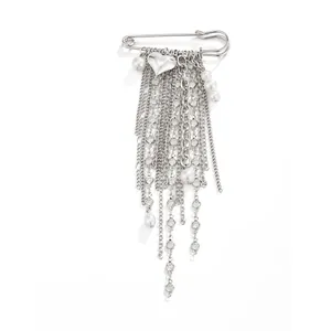 Detailed view of a silver heart tassel brooch with elegant white pearl chains