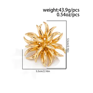 Detail view of golden firework flame brooch showing 5.5cm dimensions and 43.9g weight