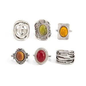 Variety of vintage silver-tone rings featuring colorful stones and intricate carvings