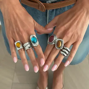 Close-up of bohemian style vintage rings with colorful gemstones and silver finish