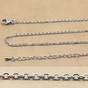 Detailed macro view of silver stainless steel oval cable chain with lobster clasp