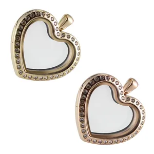 Detailed view of gold and rose gold heart glass locket pendants with sparkling rhinestones