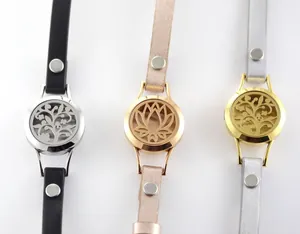 Close-up of three aromatherapy bracelets with hollowed-out locket and leather strap.