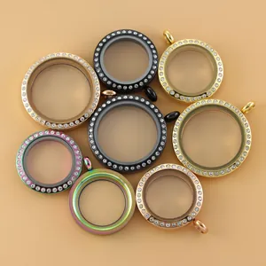 Collection of round rhinestone-bordered glass memory lockets in assorted metal tones.