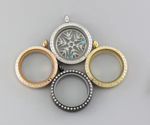 Close-up of four colors of stainless steel floating glass lockets with rhinestones