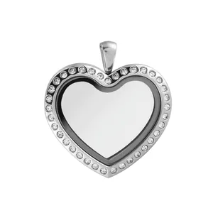 Heart-shaped stainless steel glass locket pendant with crystal border on white background