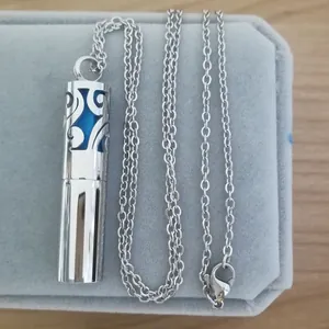 Stainless steel cylinder aromatherapy necklace with hollow scrollwork pendant