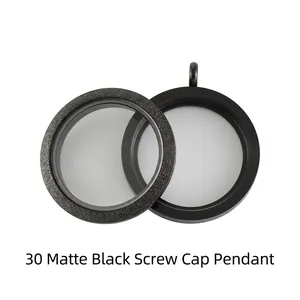 Close-up of black stainless steel frosted and smooth screw-on glass locket pendants