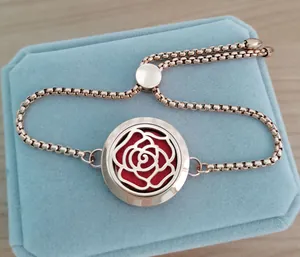 Detailed view of rose gold aromatherapy diffuser bracelet with a 25mm floral pattern locket