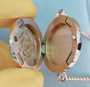 Detail view showing internal magnetic closure of open rose gold aromatherapy locket