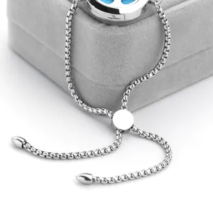Close-up of adjustable stainless steel aromatherapy bracelet showing slider clasp and box chain