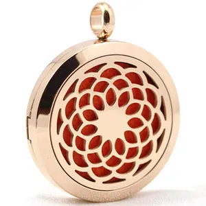 Detailed view of a rose gold aromatherapy diffuser pendant with orange felt pad.