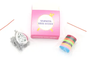 Detail view of a stainless steel teardrop locket necklace with colorful aroma pads
