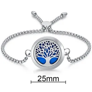 Close-up of a 25mm Tree of Life aromatherapy diffuser locket on a silver slider bracelet