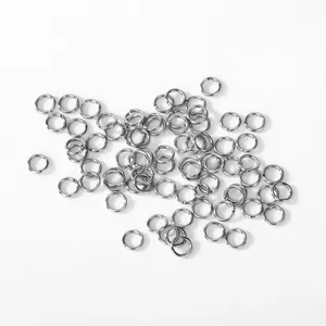 Close-up macro detail of 304 stainless steel silver jump rings for DIY jewelry making kits