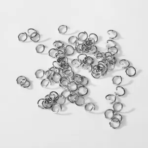 Close-up macro detail of 304 stainless steel open jump rings for DIY jewelry projects