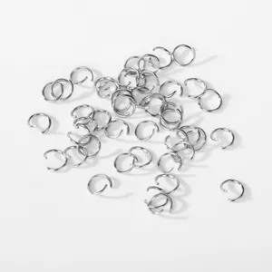 Close-up macro shot of premium 304 stainless steel open jump rings for DIY jewelry making.