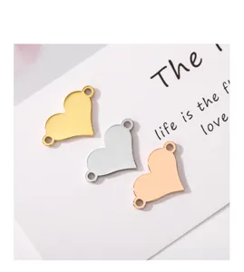 Detail view of heart-shaped stainless steel connectors in gold, silver, and rose gold