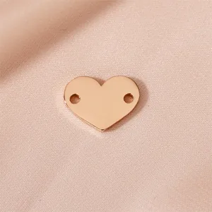 Elegant rose gold heart-shaped stainless steel charm with double holes for DIY jewelry