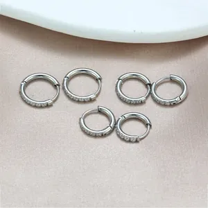 Elegant silver titanium steel hoop earrings with micro-set zircon stones for unisex wear