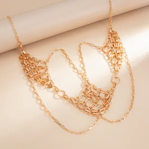 Close-up of gold woven mesh body chain with layered vintage link design