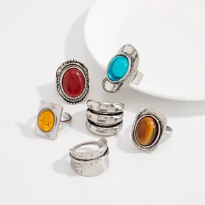 Close-up of French vintage gemstone ring set with distressed silver finish and colorful stones