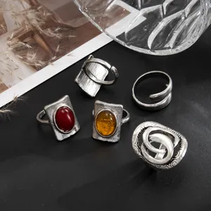 Close-up of vintage French style rings with square gemstones and oxidized finish