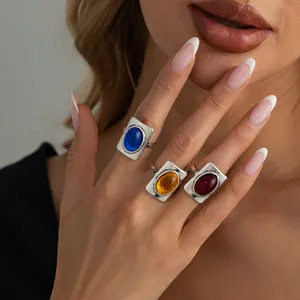 French vintage rectangular gemstone rings with antique silver finish worn by model.