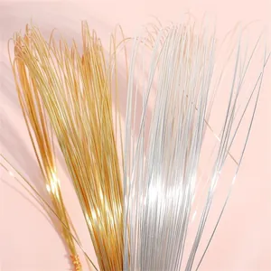 Close-up of high-quality gold and silver copper craft wire for DIY handmade jewelry.
