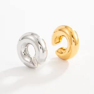 Detail view of chunky stainless steel lava ear cuffs in gold and silver finishes