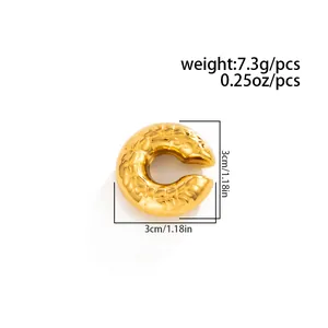 Detailed view of gold C-shape ear cuff with lava texture and 3cm size dimension markings